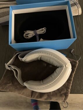 White Over-Ear eye  massager with Carry Pouch